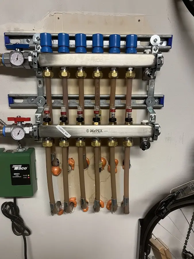 Plumber performing Water Heater Repair at a residential property in Limington